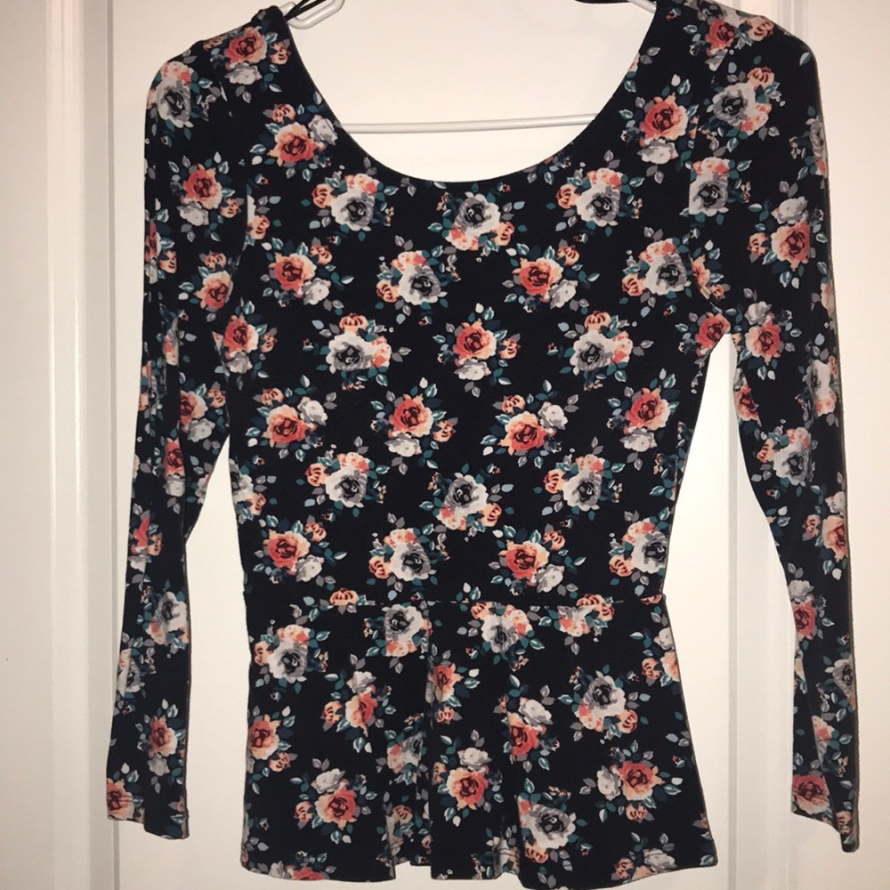 Navy peplum top with floral designs